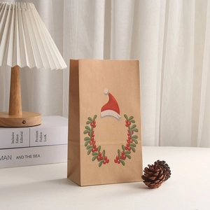 Brown kraft paper Christmas gift bag with wreath and Merry Christmas print