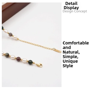 Macro view of freshwater pearl necklace with multi-colored stones and K18 gold tag