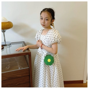 Detailed view of children's green sunflower crossbody bag with silver metal chain strap