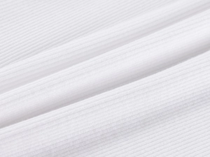 Close-up of premium white ribbed knit fabric showing fine texture and elasticity