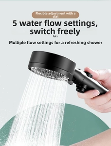 Detailed view of matte black handheld shower head with 5 modes and water stop switch