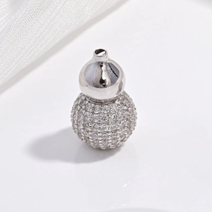 S925 sterling silver gourd pendant with sparkling pavé crystals on white fabric background