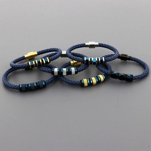 Detail of blue braided leather bracelets for men with magnetic metal clasps and beads
