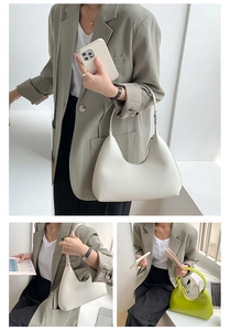 Chic beige and green PU leather hobo bags styled on a model for a modern commute look