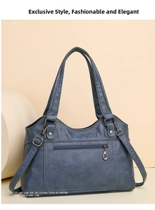Détail du sac cabas en similicuir bleu avec texture grainée, fermetures et bandoulière