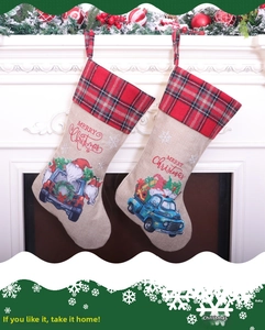 Detailed view of burlap Christmas stockings with vintage truck prints on fireplace