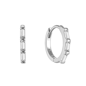 Detailed macro view of S925 sterling silver earrings with rectangular baguette diamonds