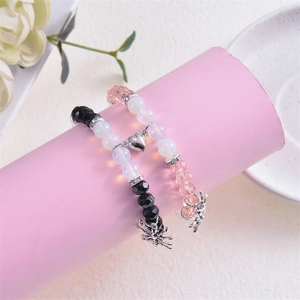 Bracelets magnétiques pour couples avec pendentif araignée et fermoir cœur en rose