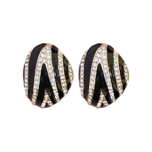 Vintage oval black enamel and gold earrings with curved rows of sparkling rhinestones