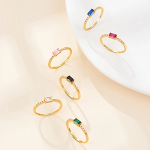 Detail of six gold-plated S925 silver rings with colorful rectangular zircon stones