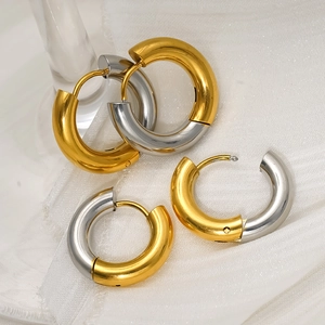 Minimalist chunky hoop earrings with two-tone gold and silver polished metal design