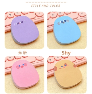Detailed close-up of cute cartoon expression sticky notes in four pastel macaron colors