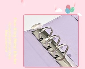 Detail of A6 purple leather binder showing the shiny six-hole metal ring mechanism