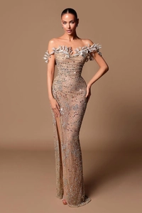 Close-up of luxury 3D leaf appliques and intricate beadwork on off-shoulder evening gown