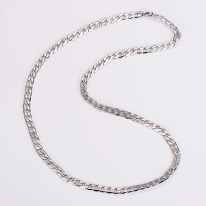 Macro shot of 7mm silver stainless steel Cuban link necklace with brushed texture detail