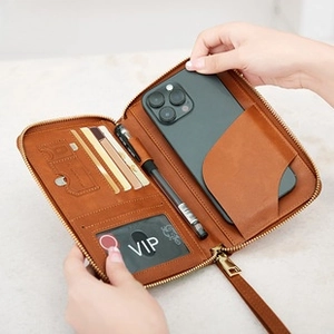 Brown leather wallet detail showing RFID protection and internal multi-card storage slots