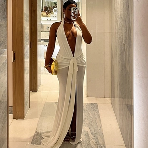 Detail of white deep V-neck halter evening dress with high slit and silky long train