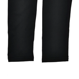 Detailed close-up of double-needle stitching on the hem of a black long sleeve bodysuit