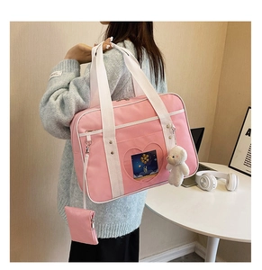 Pink heart-shaped ita bag for JK uniform with plush bear charm and small coin purse