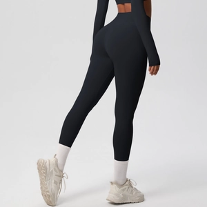 Detail of high-waisted black yoga pants with professional matte finish and sleek fit