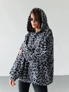 Detailed close-up of grey leopard print fleece hoodie featuring an oversized baggy fit