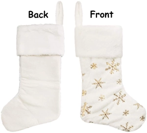 Front and back view of a white plush Christmas stocking with golden sequin snowflake embroidery