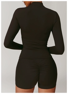 Rear view of deep brown yoga set with long sleeve top and scrunch butt fitness shorts