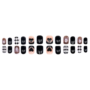Press-on nails set with black heart patterns and checkerboard design in short round style