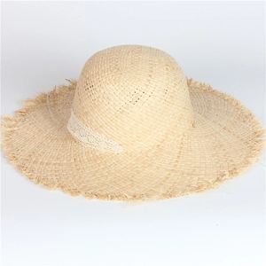 Handcrafted raffia straw sun hat with frayed wide brim and elegant lace band decoration