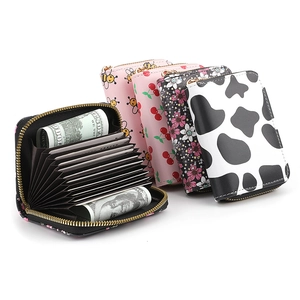 Slim accordion card wallet with floral and animal prints featuring multi-card slots