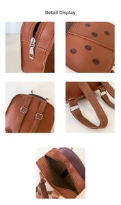 Close-up of brown ladybug toddler backpack showing metal zippers and faux leather texture