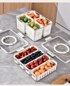 Close-up of PET food storage container featuring removable white drainage baskets