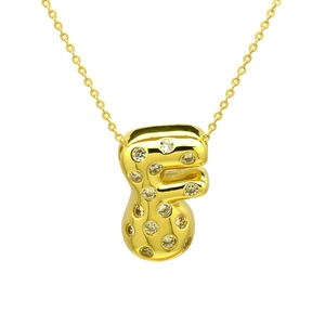Macro detail of gold bubble letter F pendant with shimmering zircon pavé on O-chain