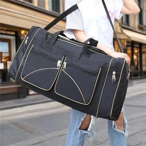 Large black Oxford travel bag with gold zippers and adjustable shoulder strap for men