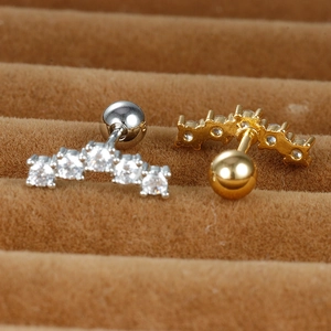 Curved stainless steel cartilage earrings with five white cubic zirconia in gold and silver