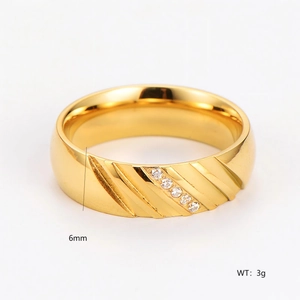 6mm gold stainless steel ring with diagonal striped grooves and small inlaid zircons
