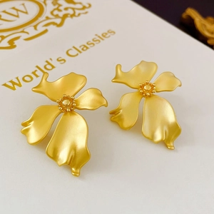 French vintage matte gold flower stud earrings with a sleek metallic texture
