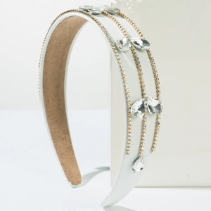 Detail of baroque white headband with triple-row rhinestones and pear-cut gemstones