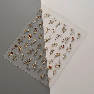 Golden floral nail art stickers with crystal rhinestones and vine designs for manicure
