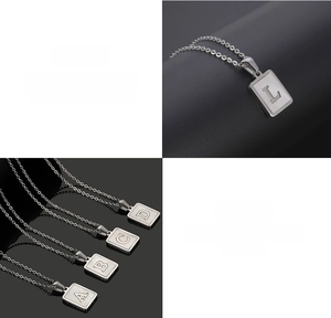 Detailed macro view of square shell alphabet necklace made of premium titanium steel
