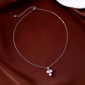 Elegant French style stainless steel necklace with three pearls pendant on red velvet