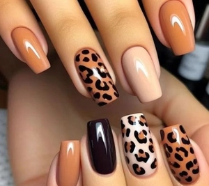 Close-up of khaki and black leopard print press-on nails in mid-length square shape
