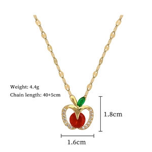 Elegant apple pendant necklace with gold frame, red crystal center and white pavé accents