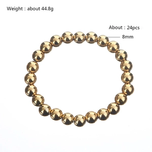Detail of 8mm golden stainless steel beaded bracelet showing bead size and 44.8g weight
