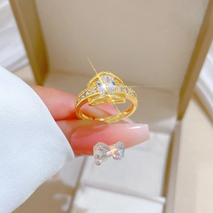 Detailed view of an adjustable gold ring featuring a large oval marquise cut crystal