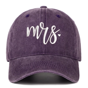 Detail of embroidered mrs text with small heart on a vintage washed purple baseball cap