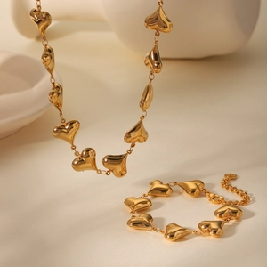 Polished 18K gold plated hollow heart necklace and bracelet set on minimalist stone