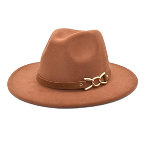Detail of a brown wool fedora with a leather band and gold buckle on a white background
