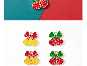 Detail of Christmas bell charms with red and green bows for DIY jewelry making