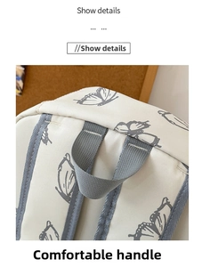 Detail shot of sturdy gray top handle and butterfly print on beige canvas backpack